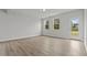 Bright living room featuring stylish gray wood flooring and natural light at 44 Fairwinds Drive Dr, Lillington, NC 27546