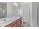 Bathroom featuring double sinks, tile flooring, and a walk-in shower at 4940 Heathshire Dr, Raleigh, NC 27616