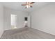 Bedroom with carpet, ceiling fan, and view of rooms beyond at 4940 Heathshire Dr, Raleigh, NC 27616
