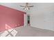 Bedroom featuring carpeted floors, a ceiling fan, and a large window at 4940 Heathshire Dr, Raleigh, NC 27616