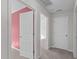 Hallway featuring carpeted floors and several doors leading to other rooms at 4940 Heathshire Dr, Raleigh, NC 27616