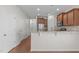 Well-lit kitchen with modern appliances, wood cabinets, and open layout to the dining area at 4940 Heathshire Dr, Raleigh, NC 27616