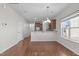 Bright and open kitchen with stainless steel appliances and breakfast bar overlooking the dining area at 4940 Heathshire Dr, Raleigh, NC 27616