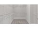 Spacious walk-in closet with shelving and carpeted floors at 4940 Heathshire Dr, Raleigh, NC 27616