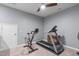 Basement featuring an exercise bike, a treadmill, and a ceiling fan at 50 Sneed Ln, Fuquay Varina, NC 27526