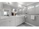 Modern bathroom featuring dual sinks, white cabinets, and a large tiled shower at 50 Sneed Ln, Fuquay Varina, NC 27526