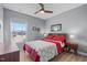 Comfortable bedroom with hardwood floors, a double bed, and a large bright window at 50 Sneed Ln, Fuquay Varina, NC 27526