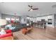 Spacious open-concept living area with a dining room, and a modern kitchen featuring barstool seating at 50 Sneed Ln, Fuquay Varina, NC 27526