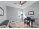 Cozy living area with a modern ceiling fan and a stylish black piano at 50 Sneed Ln, Fuquay Varina, NC 27526