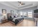 Spacious main bedroom with tray ceiling, modern decor, and backyard views at 50 Sneed Ln, Fuquay Varina, NC 27526