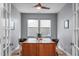 Home office with large wood desk, two chairs, hardwood floors, and natural light at 50 Sneed Ln, Fuquay Varina, NC 27526