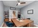 Bright home office space features a large desk, hardwood floors, and staircase access at 50 Sneed Ln, Fuquay Varina, NC 27526