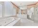 Bathroom boasts a soaking tub, glass-enclosed shower, and double vanities at 50002 Brogden, Chapel Hill, NC 27517
