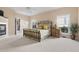Spacious main bedroom with a metal bed frame, fireplace, and plenty of natural light at 50002 Brogden, Chapel Hill, NC 27517