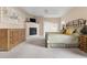Cozy bedroom featuring a fireplace, neutral color palette, and plush carpeting at 50002 Brogden, Chapel Hill, NC 27517