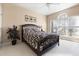 Comfortable bedroom with a large window that brings in natural light and a ceiling fan at 50002 Brogden, Chapel Hill, NC 27517