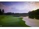 Picturesque golf course view featuring lush greens and a tranquil lake at sunset at 50002 Brogden, Chapel Hill, NC 27517