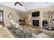 Spacious living room with hardwood floors, a stone fireplace, and open access to other living spaces at 50002 Brogden, Chapel Hill, NC 27517