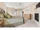 Serene main bedroom featuring plush carpeting, a tray ceiling, and a decorative fireplace at 50002 Brogden, Chapel Hill, NC 27517