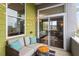 Cozy balcony featuring comfortable seating, a table, and string lights at 506 N Mangum St # 303, Durham, NC 27701