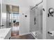 Modern bathroom with a glass-enclosed shower and neutral finishes at 506 N Mangum St # 303, Durham, NC 27701