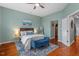 Relaxing bedroom with hardwood floors and ample natural light at 506 N Mangum St # 303, Durham, NC 27701