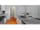 Chic kitchen with a functional island, stainless steel sink, and easy access to other rooms at 506 N Mangum St # 303, Durham, NC 27701