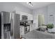 Contemporary kitchen with stainless steel appliances, white cabinets, and granite countertop island at 506 N Mangum St # 303, Durham, NC 27701