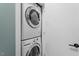 Efficient laundry area with stacked washer and dryer at 506 N Mangum St # 303, Durham, NC 27701