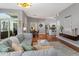Open-concept living area with comfortable seating, dining space, and kitchen in the background at 506 N Mangum St # 303, Durham, NC 27701