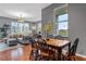 Bright living room with comfortable seating, dining area, and large windows with cityscape views at 506 N Mangum St # 303, Durham, NC 27701