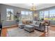 Bright living room featuring hardwood floors, large windows with city views and comfortable seating at 506 N Mangum St # 303, Durham, NC 27701