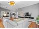 Comfortable living room featuring modern decor, a TV, and an open layout to the dining area and kitchen at 506 N Mangum St # 303, Durham, NC 27701