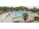 Aerial view of a resort-style community pool area with lounge chairs and slides at 510 Berry Chase Way, Cary, NC 27519