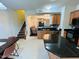 Open kitchen design with dark countertops, stainless steel appliances, and easy access to living areas at 510 Berry Chase Way, Cary, NC 27519
