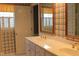 Bathroom featuring a double vanity and vintage wallpaper for a pop of personality at 515 S Woodland Rd, Henderson, NC 27536