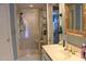 Bathroom featuring a glass-enclosed shower, vanity and a well-lit space at 515 S Woodland Rd, Henderson, NC 27536