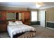Spacious bedroom with a ceiling fan, a window, and built-in cabinetry at 515 S Woodland Rd, Henderson, NC 27536