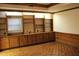 Bonus room with custom built-in shelves and cabinets for storage and decor display at 515 S Woodland Rd, Henderson, NC 27536
