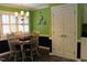 Cozy dining area features a chandelier and large window for natural light at 515 S Woodland Rd, Henderson, NC 27536
