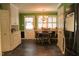 Eat-in dining area featuring a charming chandelier and natural light from the window at 515 S Woodland Rd, Henderson, NC 27536