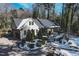 The front yard of this charming home is blanketed with a fresh snowfall at 515 S Woodland Rd, Henderson, NC 27536