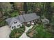 A beautiful single story home is captured from above and features professionally landscaped front yard at 515 S Woodland Rd, Henderson, NC 27536