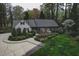 Lovely single story home featuring a winding walkway and a beautiful, professionally landscaped front yard at 515 S Woodland Rd, Henderson, NC 27536
