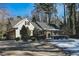 Single Gathering home featuring a brick exterior, manicured bushes, and driveway at 515 S Woodland Rd, Henderson, NC 27536