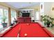Game room area showing a pool table with a large window overlooking the backyard at 515 S Woodland Rd, Henderson, NC 27536