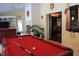 Spacious game room with pool table and fireplace, offering a great space for entertaining at 515 S Woodland Rd, Henderson, NC 27536