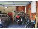Organized garage with a car, motorcycle, tools, and shelving at 515 S Woodland Rd, Henderson, NC 27536