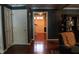 Hallway features hardwood floors and leads to various rooms within the home at 515 S Woodland Rd, Henderson, NC 27536