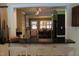 Bright kitchen features a breakfast bar, sleek countertops and a pass-through to dining area at 515 S Woodland Rd, Henderson, NC 27536